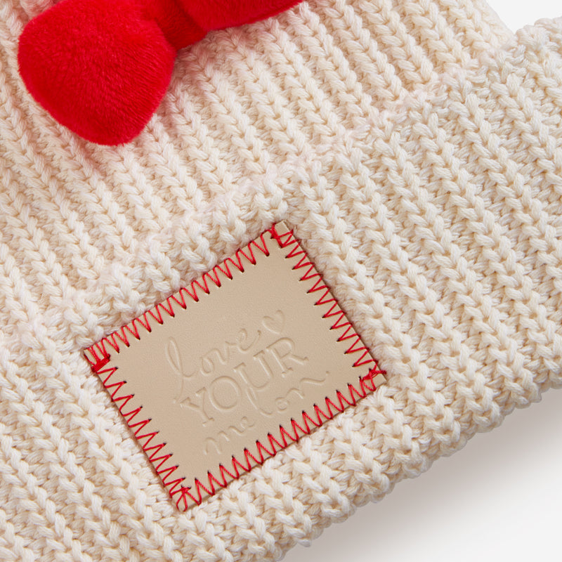 An up close shot of the Love Your Melon patch that has been stitched on the Hello Kitty Beanie.
